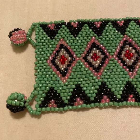 Handmade Huichol-style seed bead bracelet featuring green, black, pink & red. - Picture 3 of 6